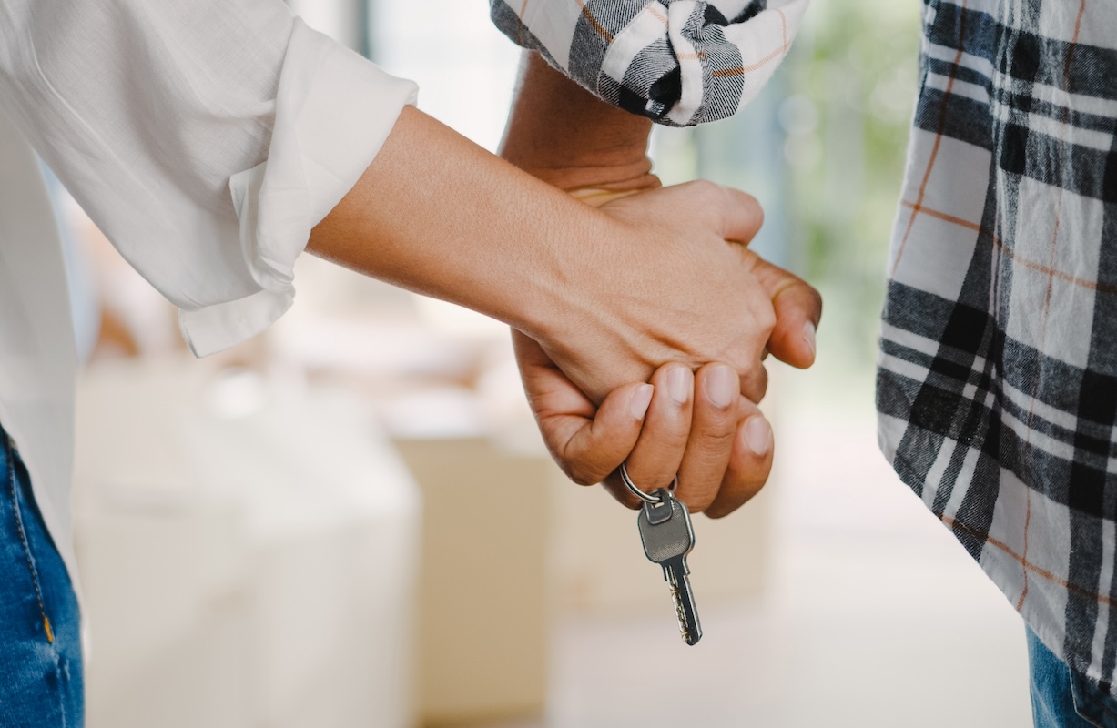 couple holding house key