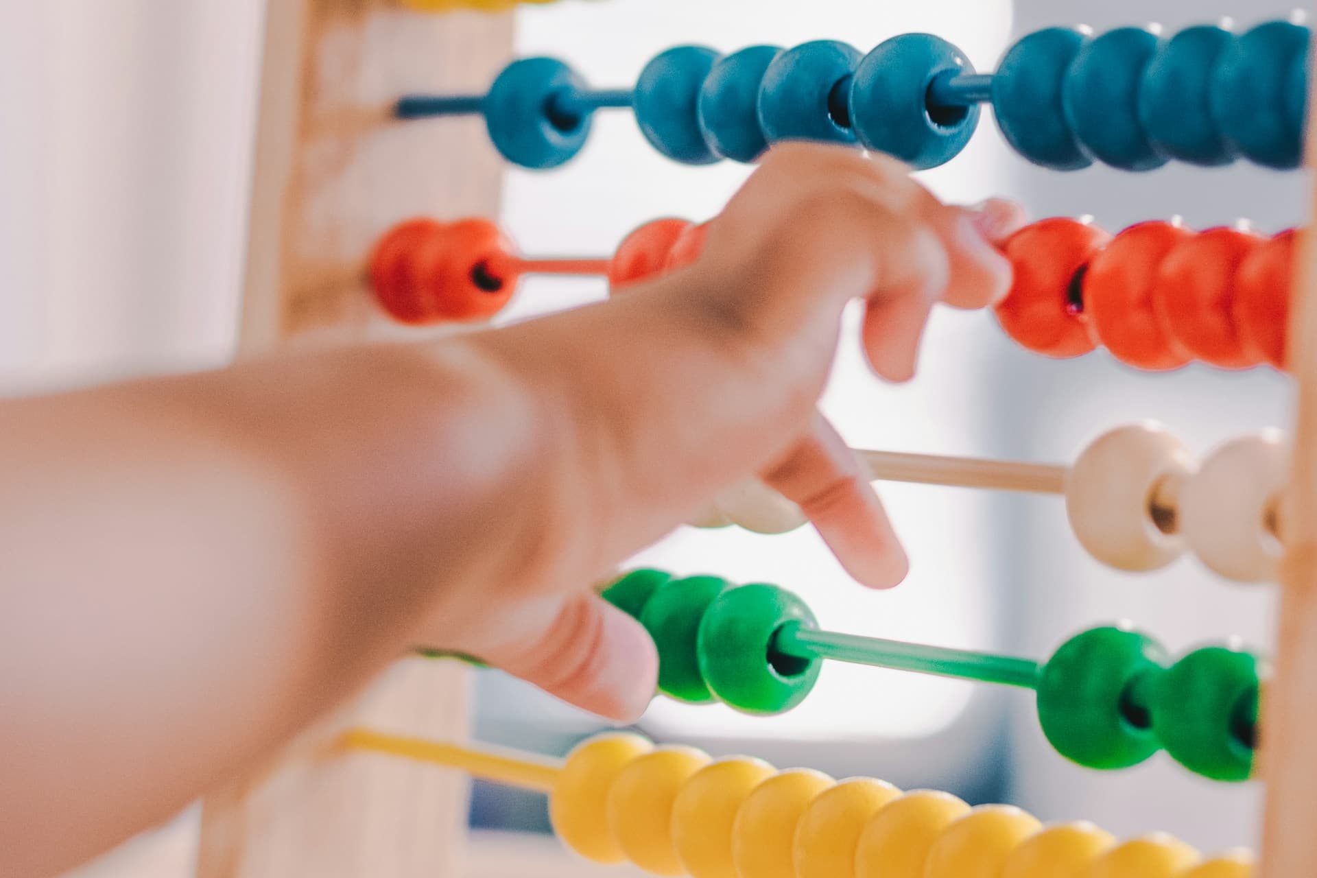 Baby's hand playing with toy
